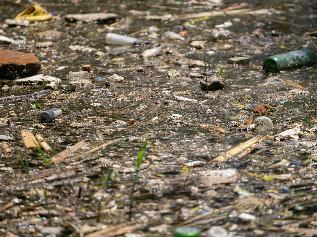 Industrial site with containment berms and spill kits labeled Pollution Prevention Measures